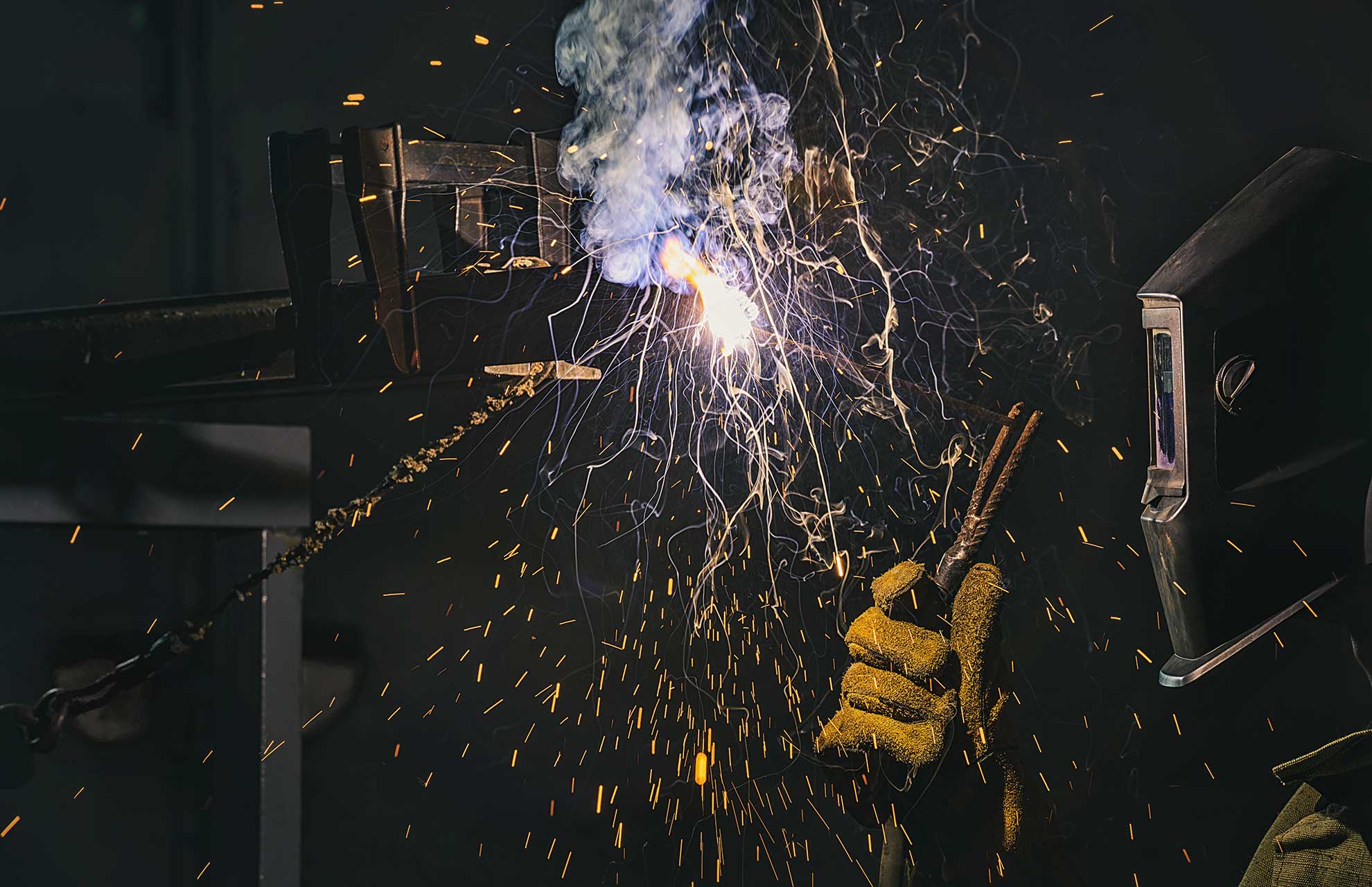 side-view-of-welder-in-protection-mask-working-wit-2N7QKN3