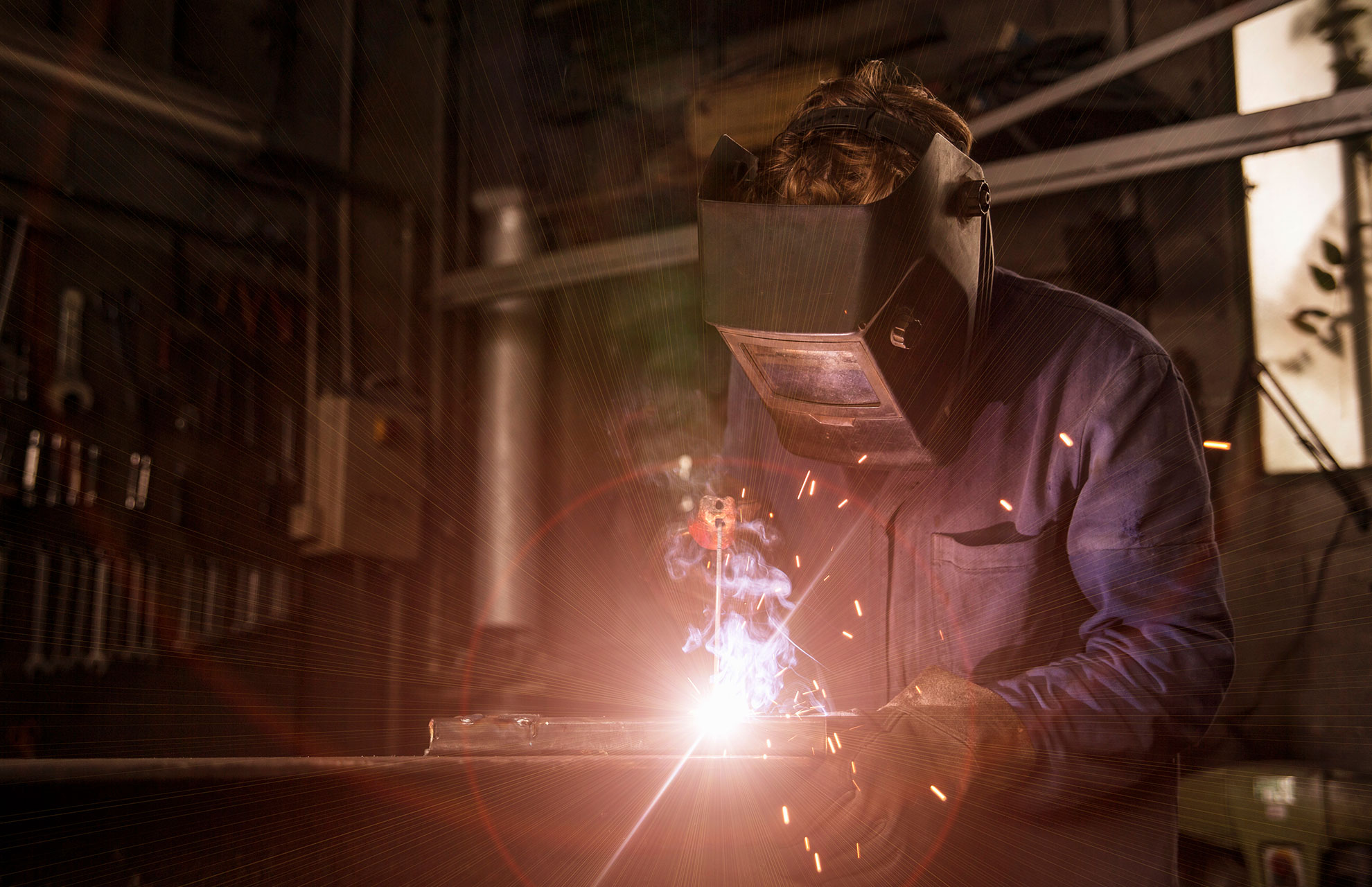 welder-soldering-iron-in-workshop-RM65M39